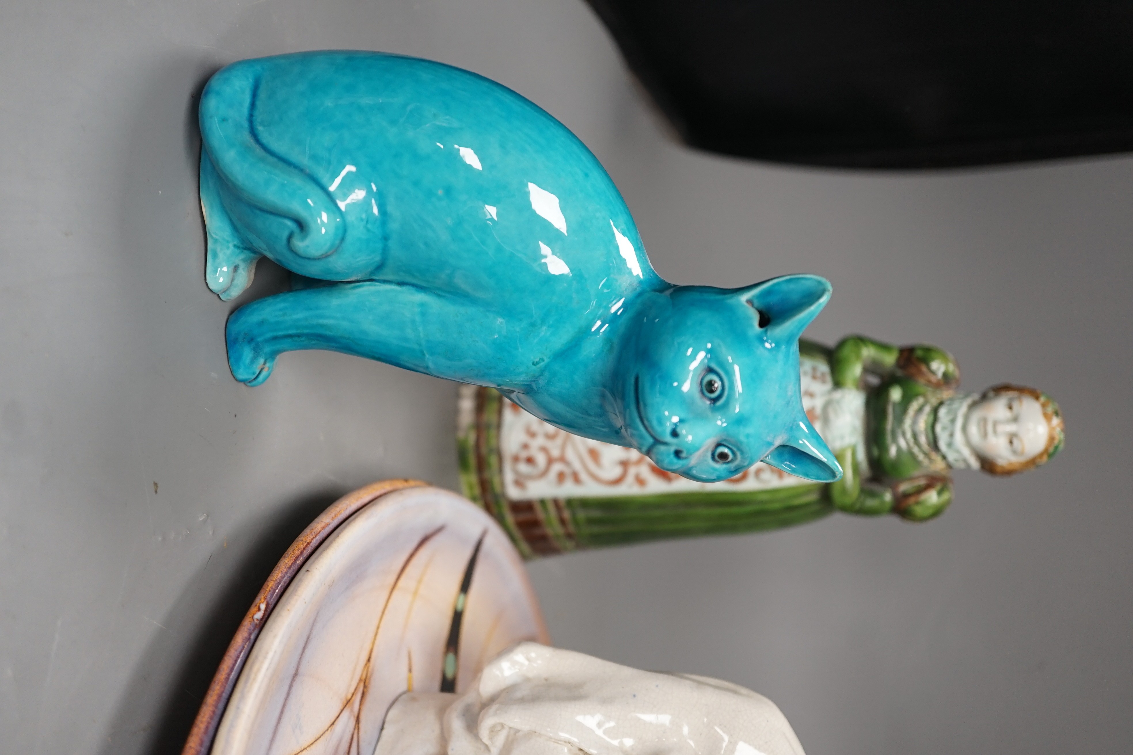 A selection of ceramics, to include two Vallauris plates, a bust of Madonna and child signed ‘Helen Fraser Rock 1925’, a Dutch figure and a pair of turquoise glazed cats etc.